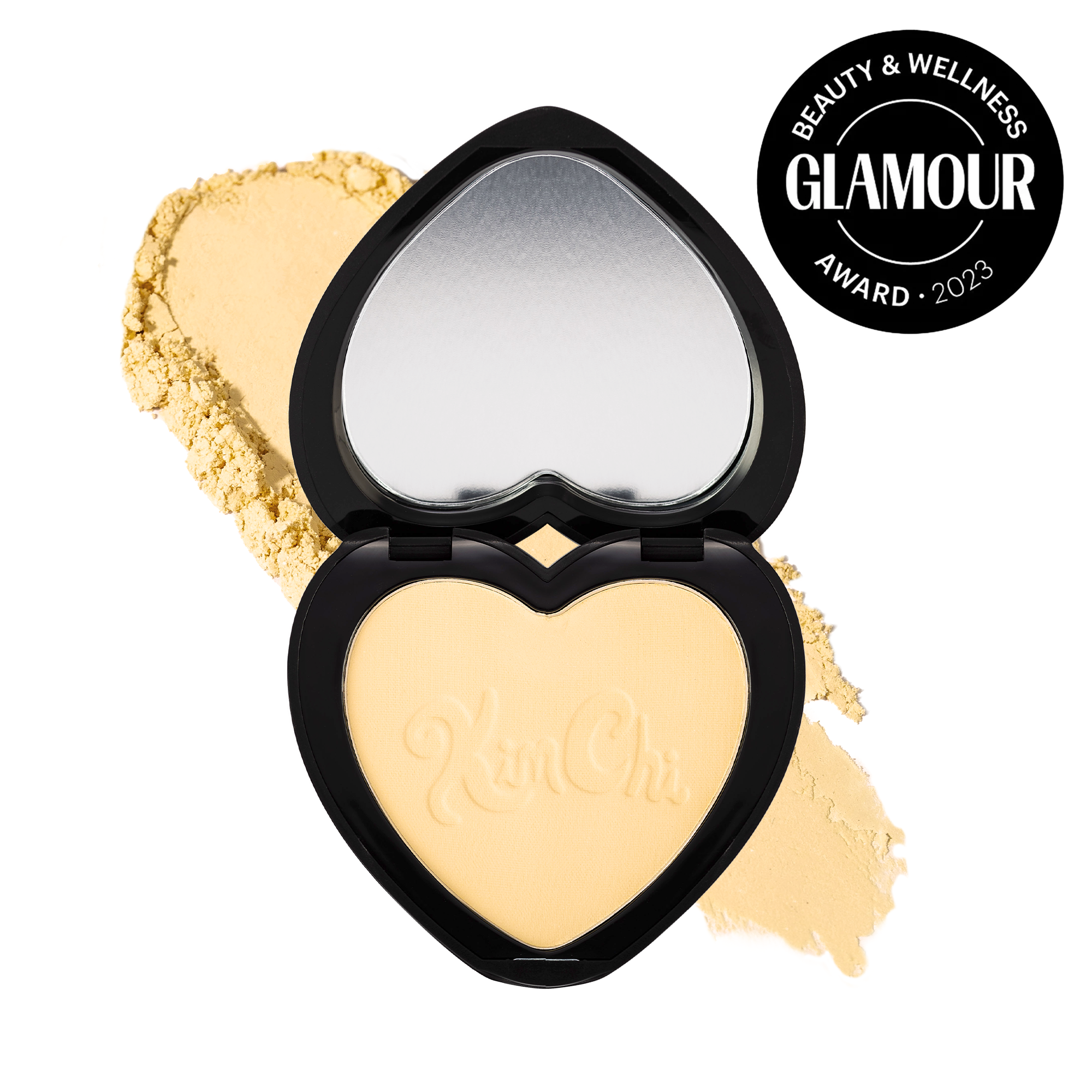Kim Chi heart-shaped powder compact in yellow, award-winning beauty product, perfect for setting makeup.