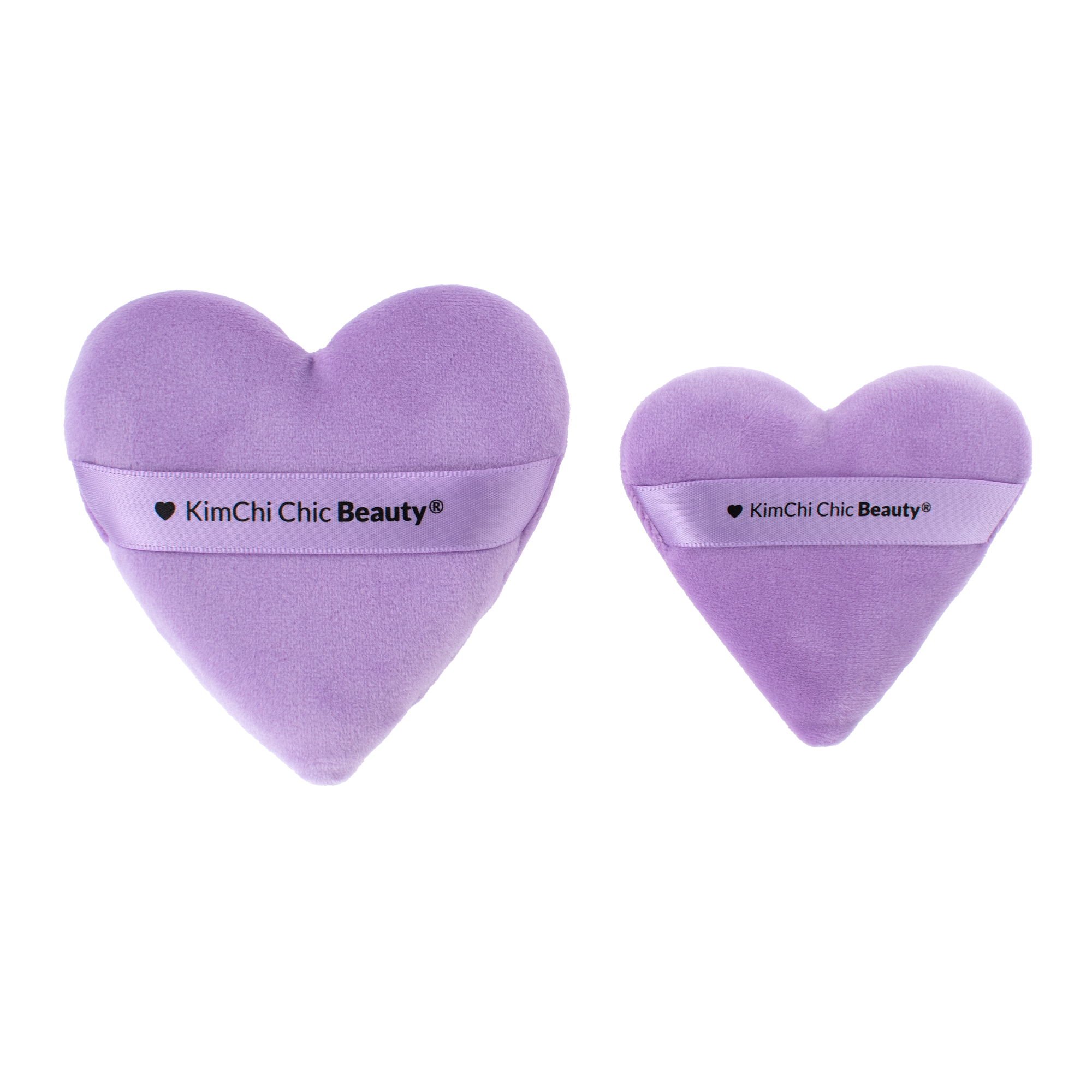 Set of two purple heart-shaped cosmetics sponges by KimChi Chic Beauty for flawless makeup application.