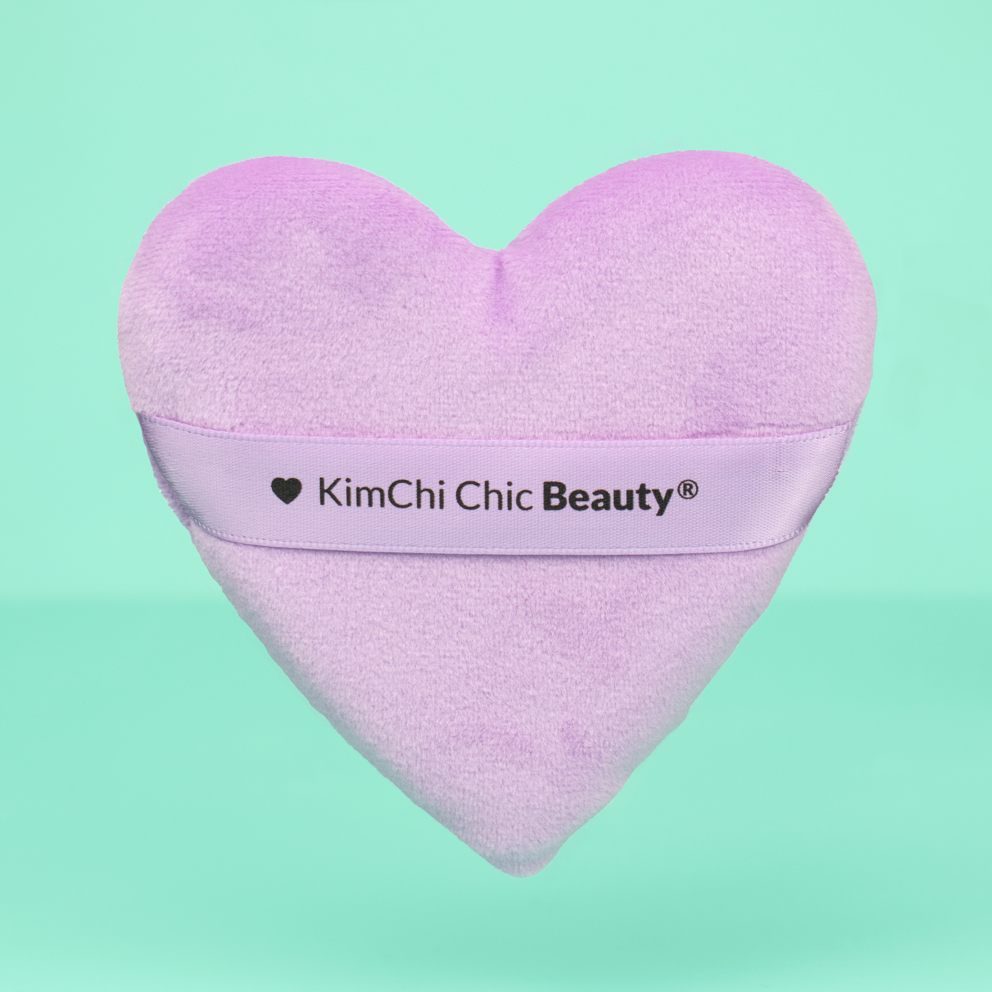 KimChi Chic Beauty heart-shaped makeup sponge, soft lavender color, ideal for blending and applying cosmetics.