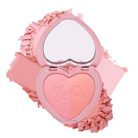 Heart-shaped blush compact in soft pink shades, featuring a mirror and velvety finish for a radiant look.