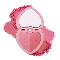 Heart-shaped pink blush compact with mirror and dual shades, perfect for a fresh, natural look.