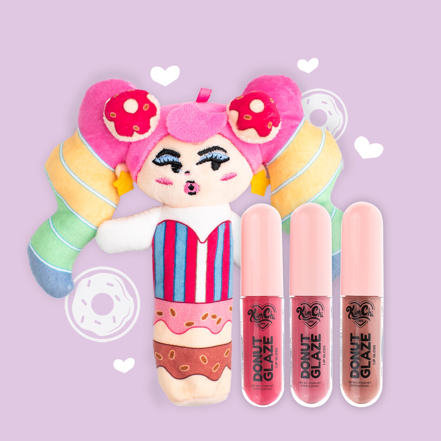 A colorful plush doll with pink hair and striped outfit next to three lip gloss tubes on a pastel background.