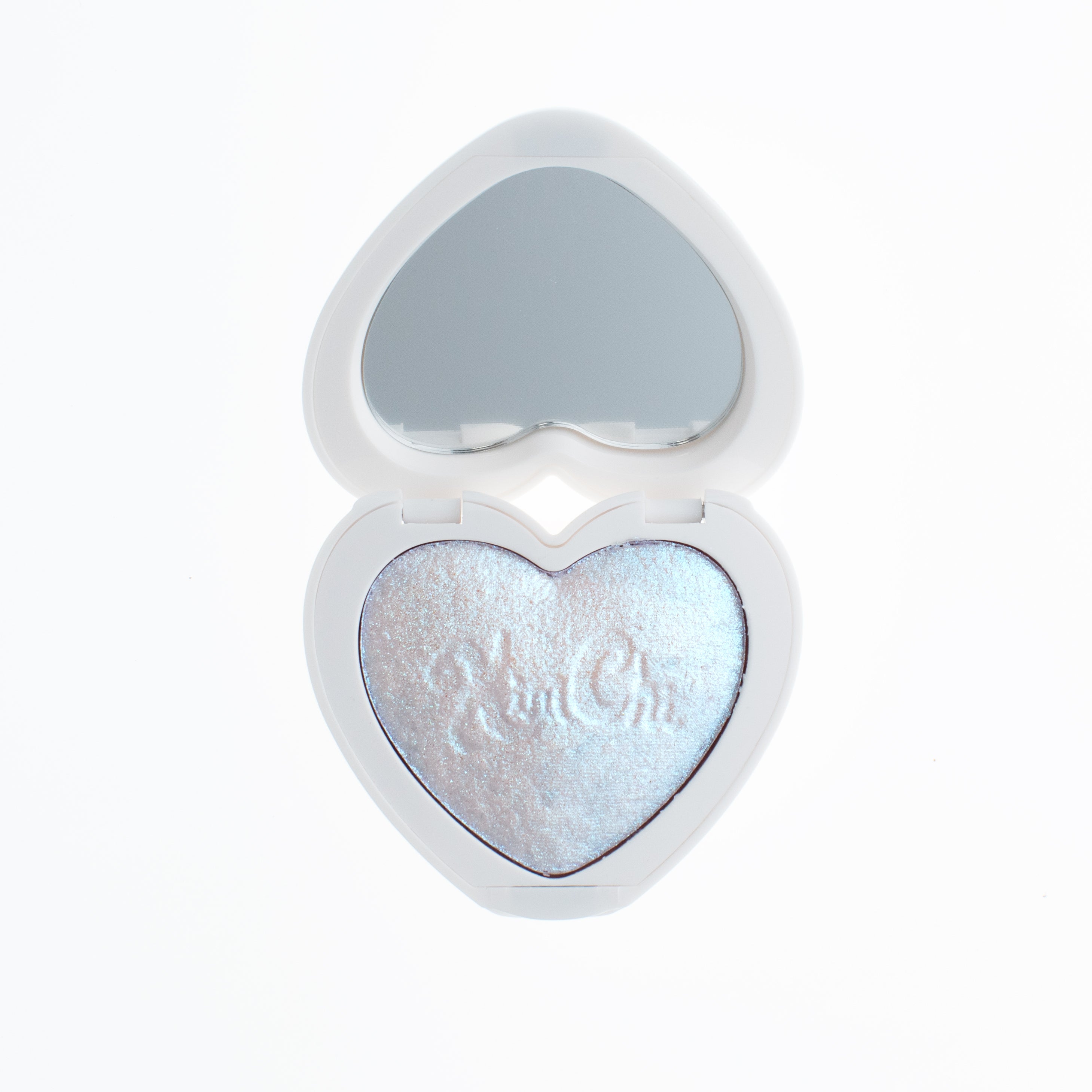 Heart-shaped open compact with a mirror and iridescent makeup inside