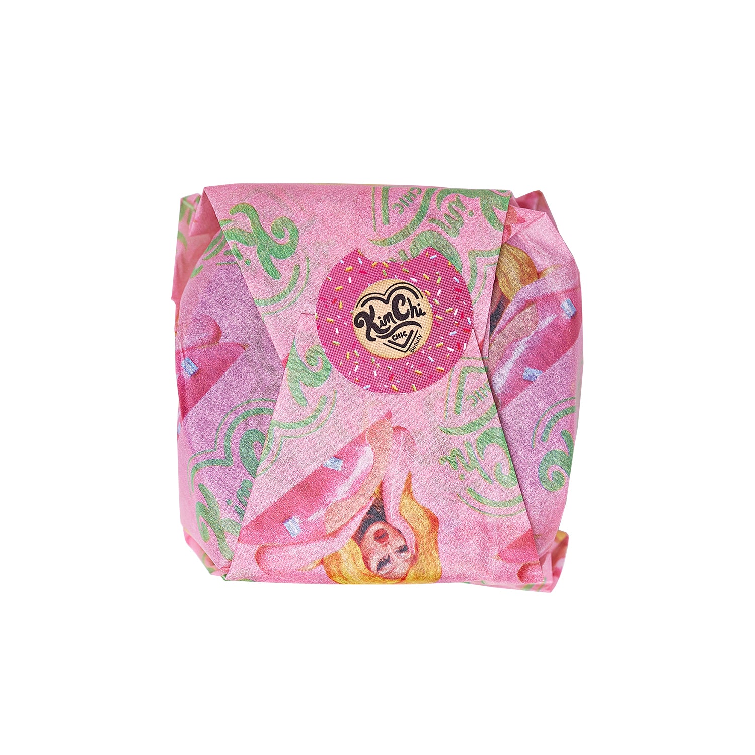A wrapped colorful soap featuring whimsical designs in pink and green.