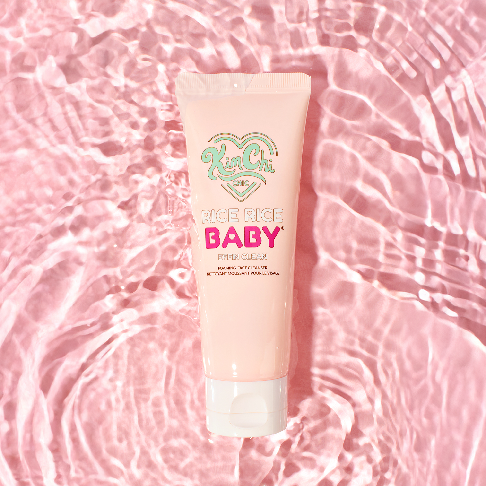 Kim Chi Rice Rice Baby Foaming Face Cleanser, pink tube on water background, 120ml.