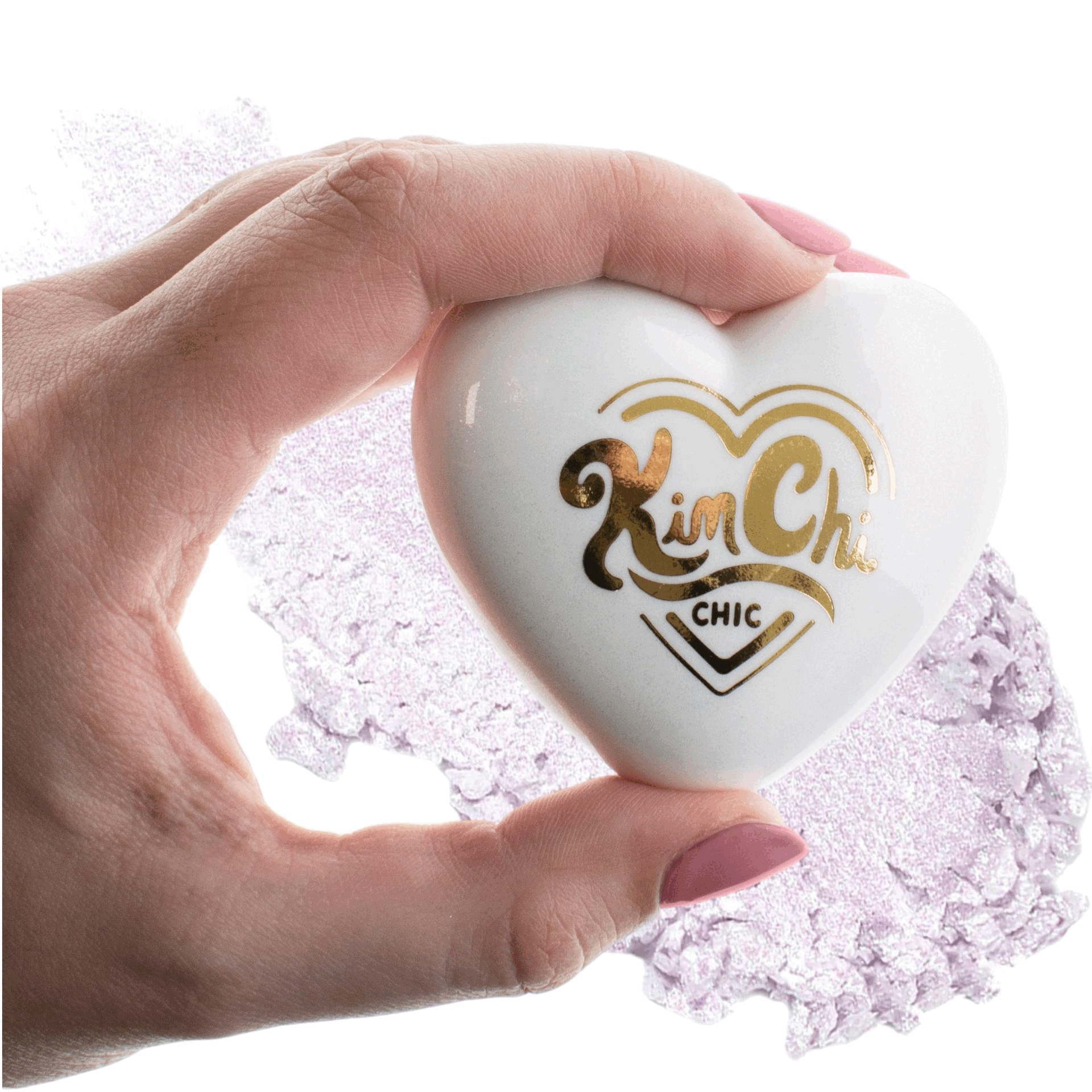 A hand holding a heart-shaped cosmetic product with 'Kim Chi CHIC' printed on it.