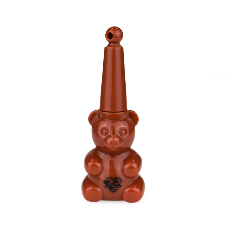 Brown bear-shaped object with a tall, narrow nozzle on top