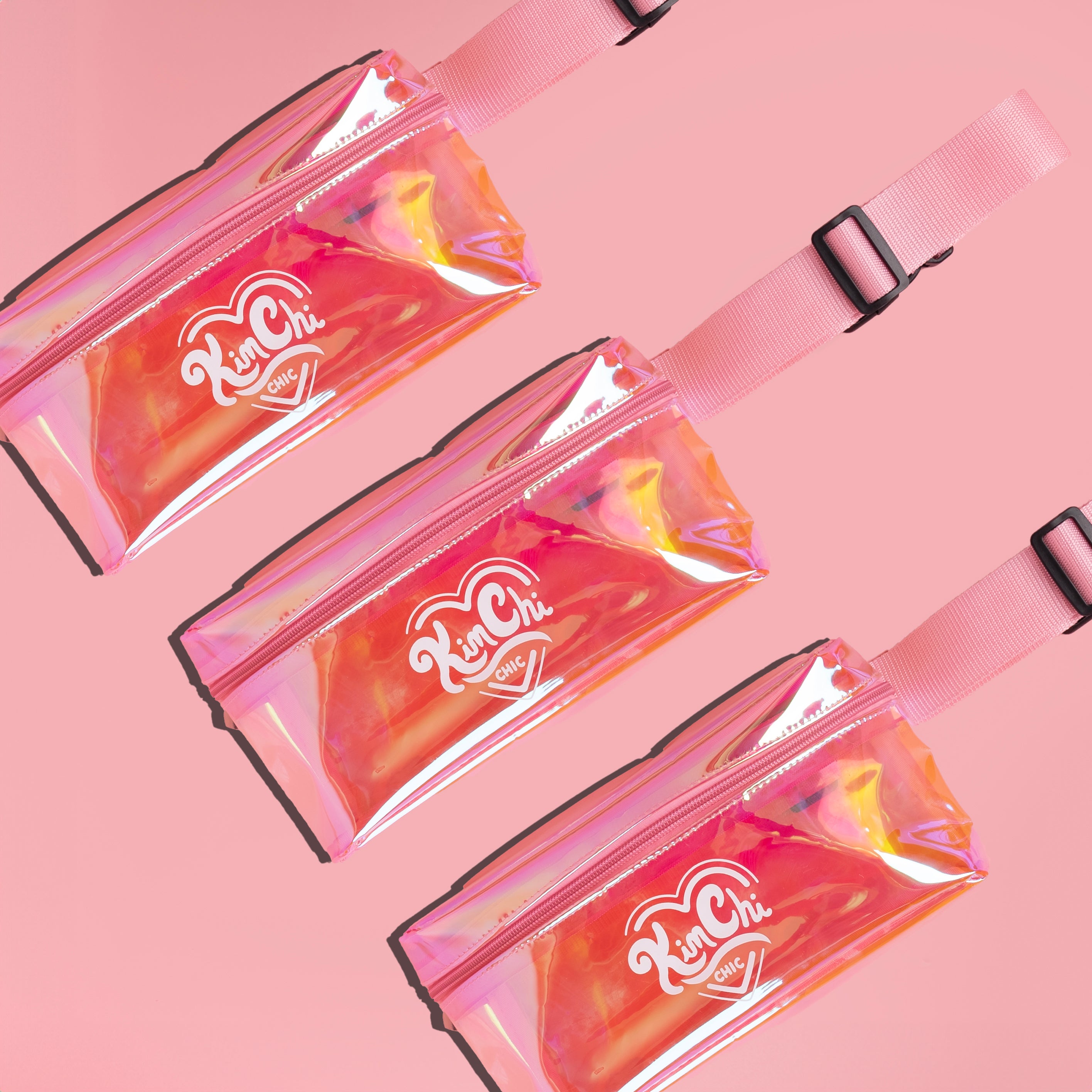 Three pink transparent fanny packs with logo on pink background