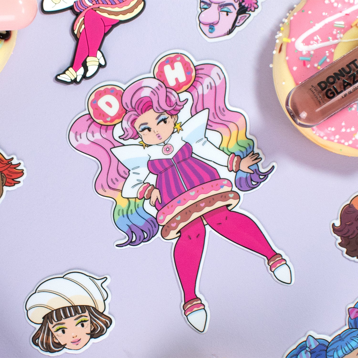 Colorful stickers featuring cartoon characters and designs on a pastel background