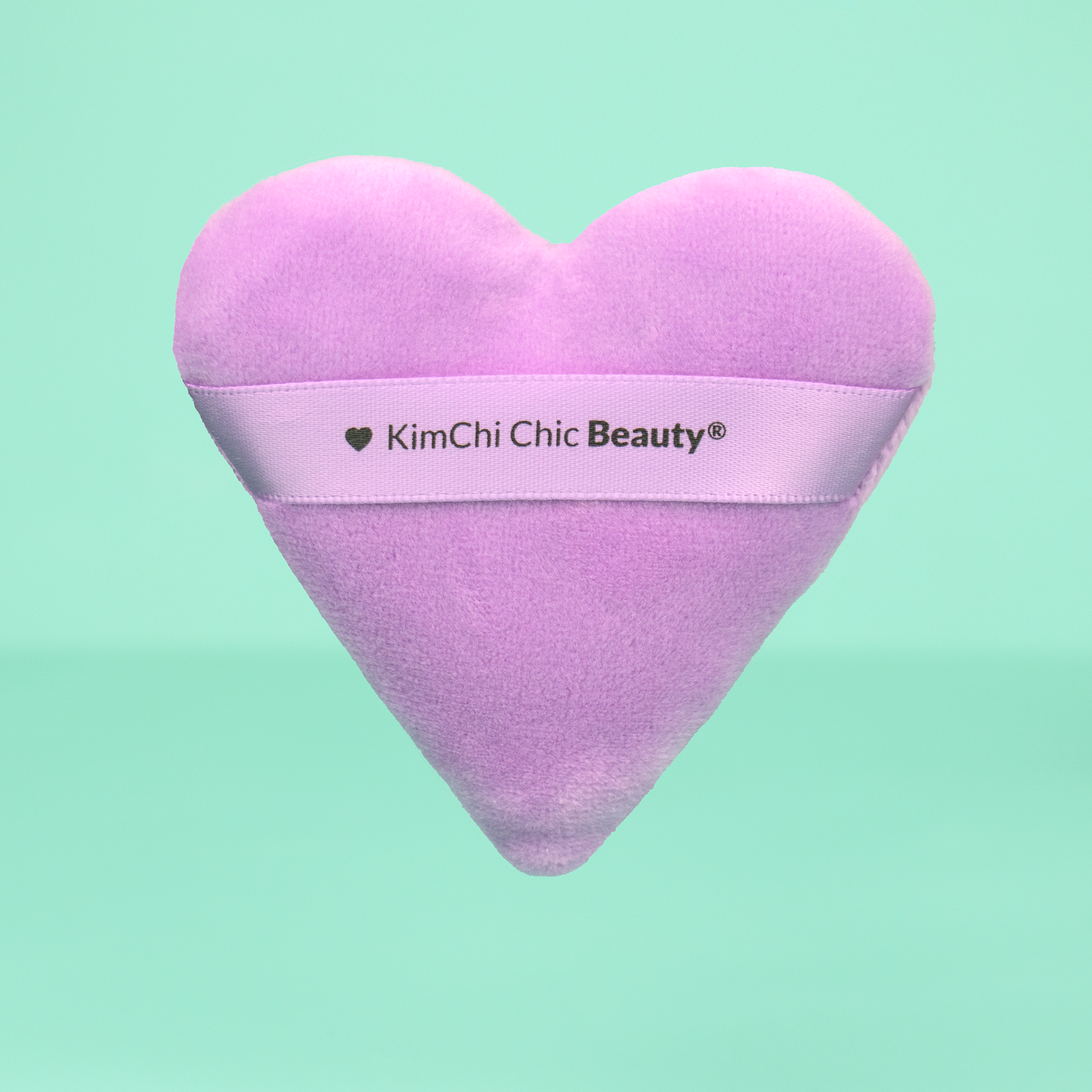 KimChi Chic Beauty heart-shaped purple makeup sponge, plush material for flawless application.