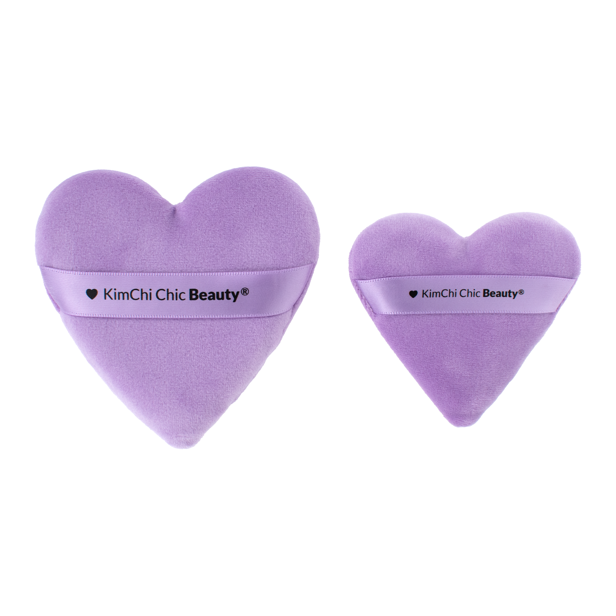 Set of two purple heart-shaped makeup sponges by KimChi Chic Beauty, soft velvet finish for seamless application.