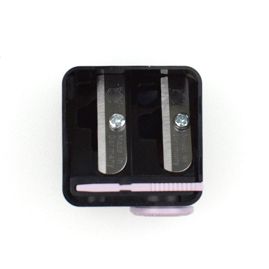 Dual-hole pencil sharpener with a closed lid design.