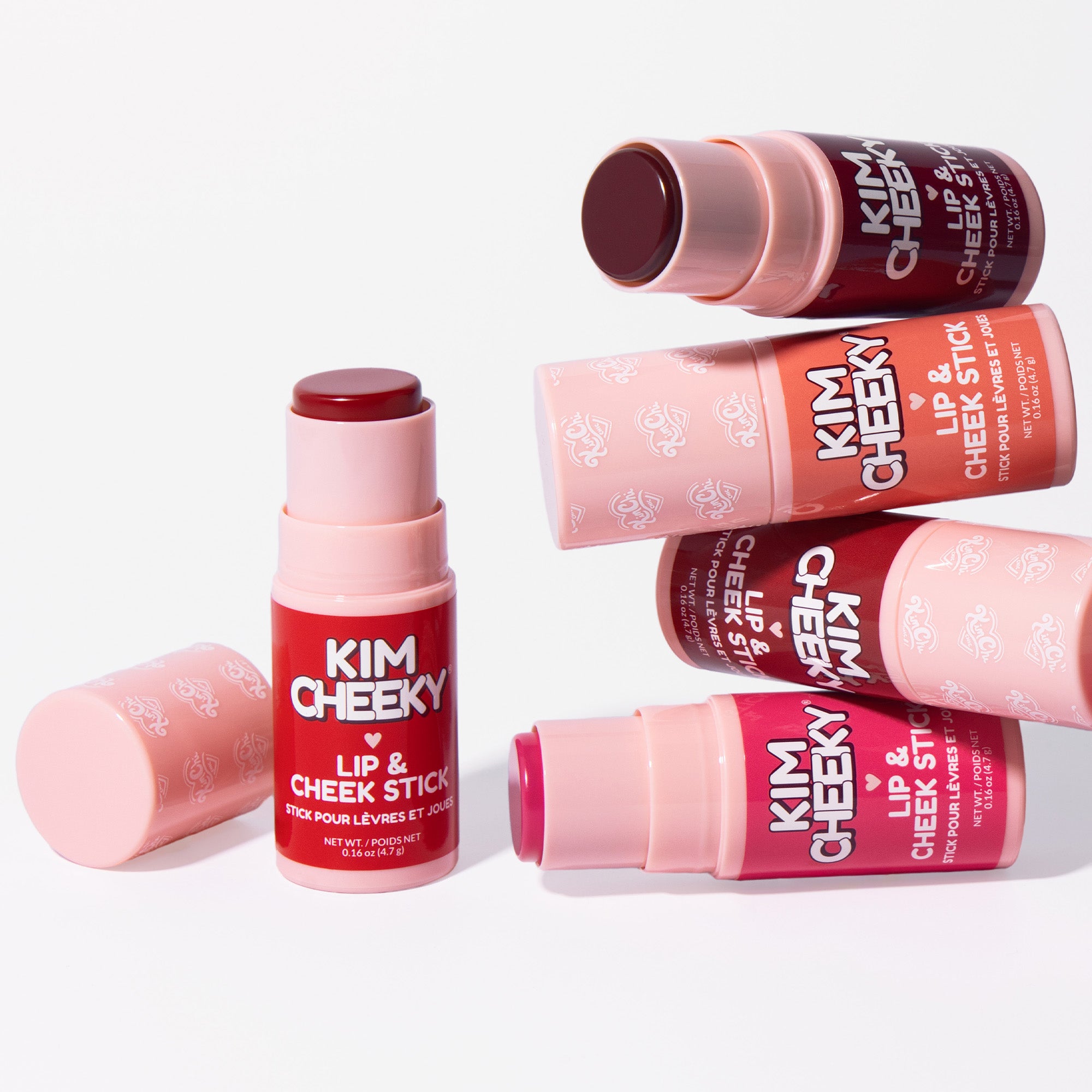 Various lip and cheek stick cosmetics by Kim Cheeky in packaging.