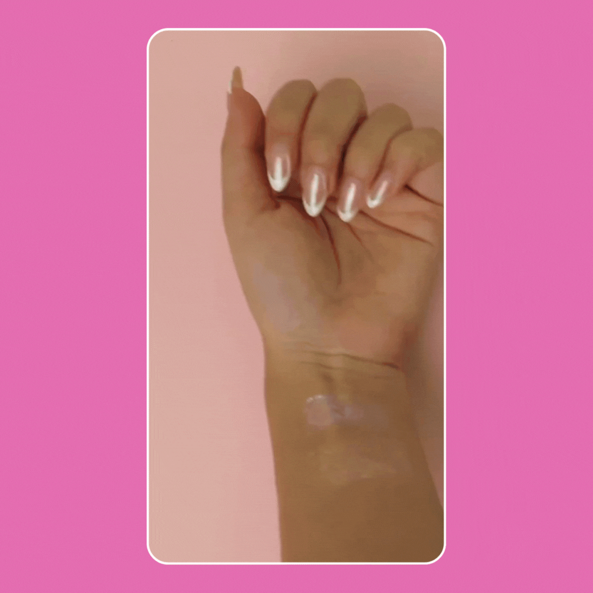 Close-up of manicured hand showing iridescent nail polish on nails and skin swatch.