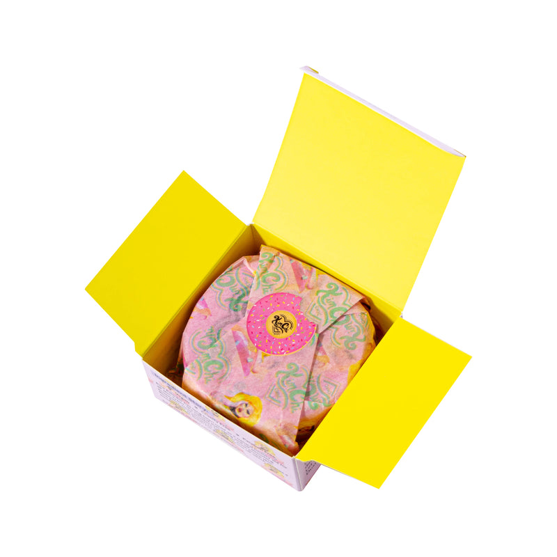 Open yellow gift box with floral-patterned fabric inside