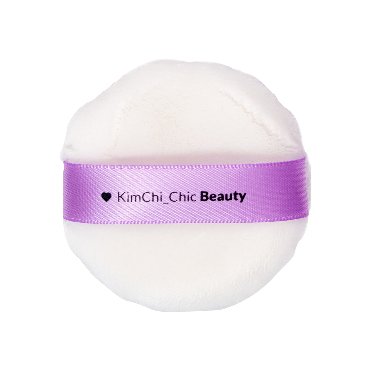 Round white makeup puff with a purple KimChi Chic Beauty ribbon