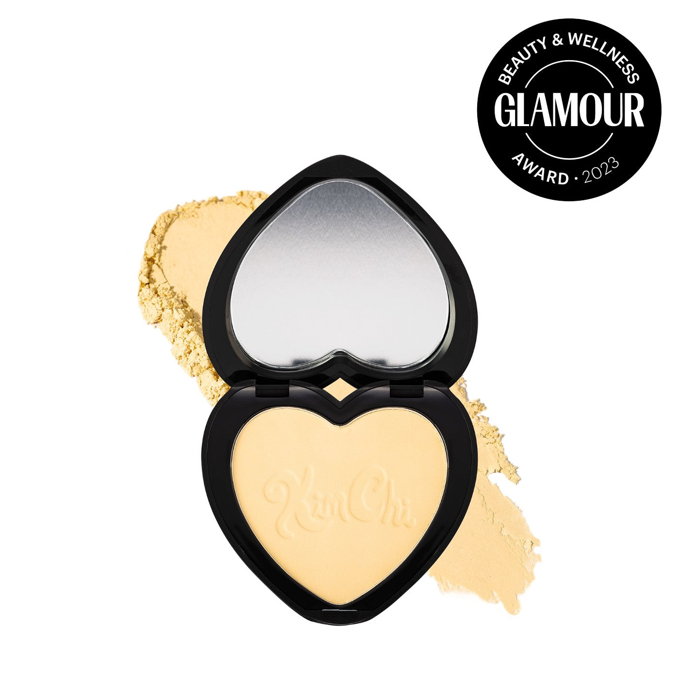 Heart-shaped compact with powder and Glamour Beauty and Wellness Award 2023 badge.