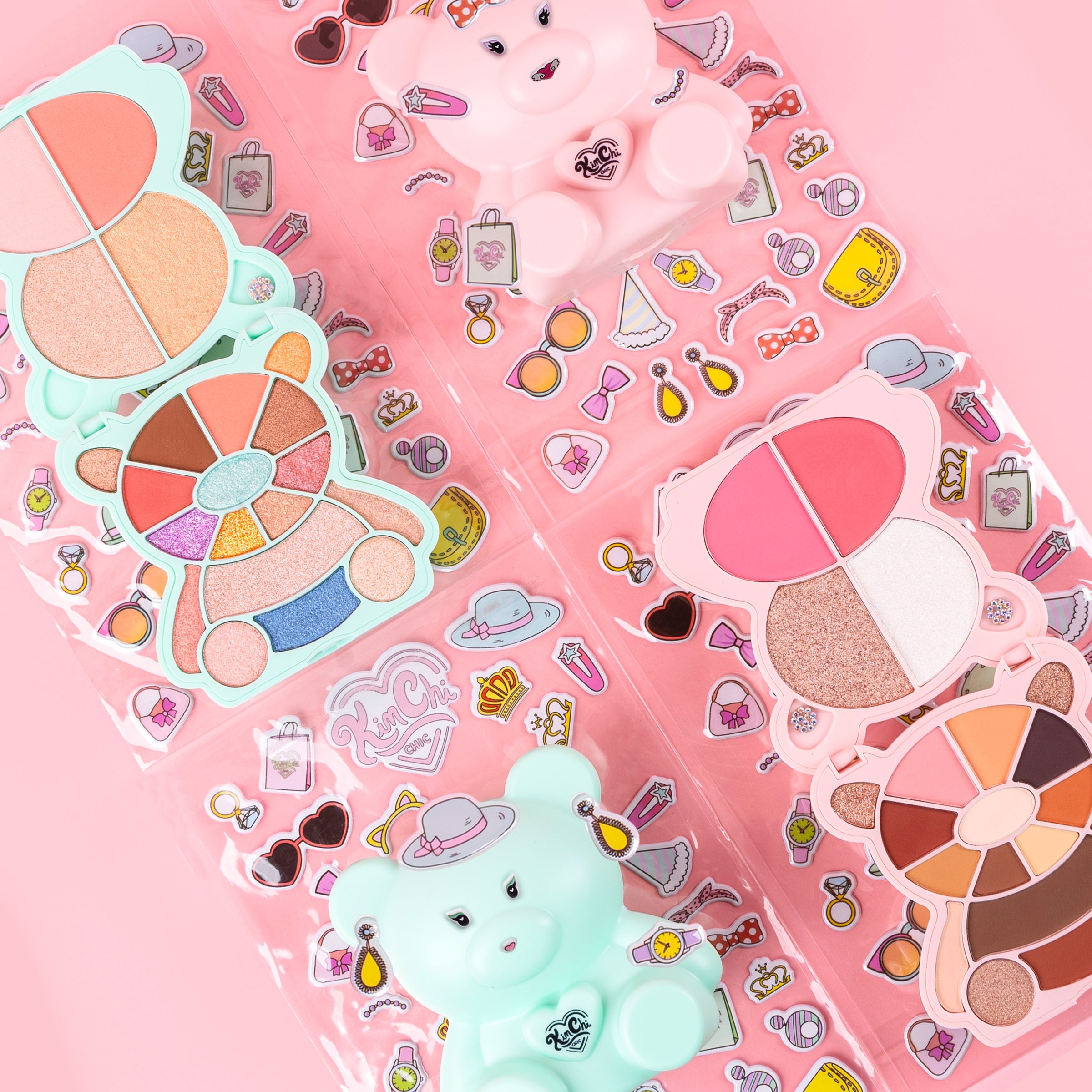 Cute bear-themed eyeshadow palettes on a pink background with colorful stickers.