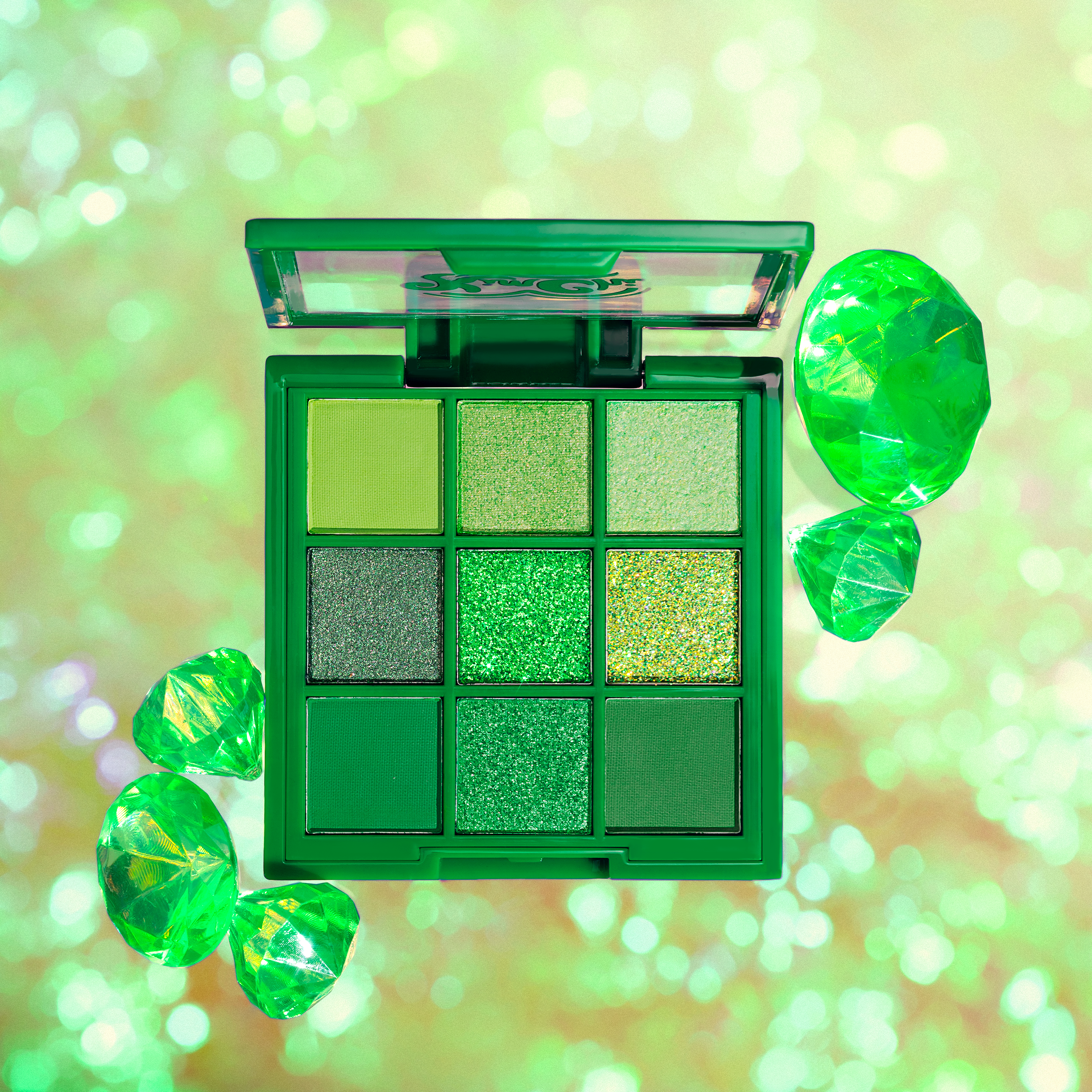 Green eyeshadow palette with sparkling gems