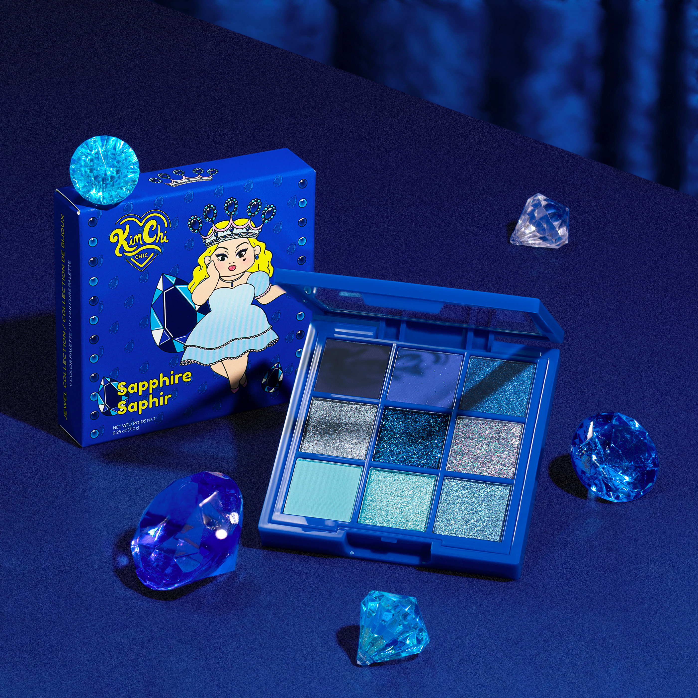 Blue-themed eyeshadow palette and packaging with decorative crystals