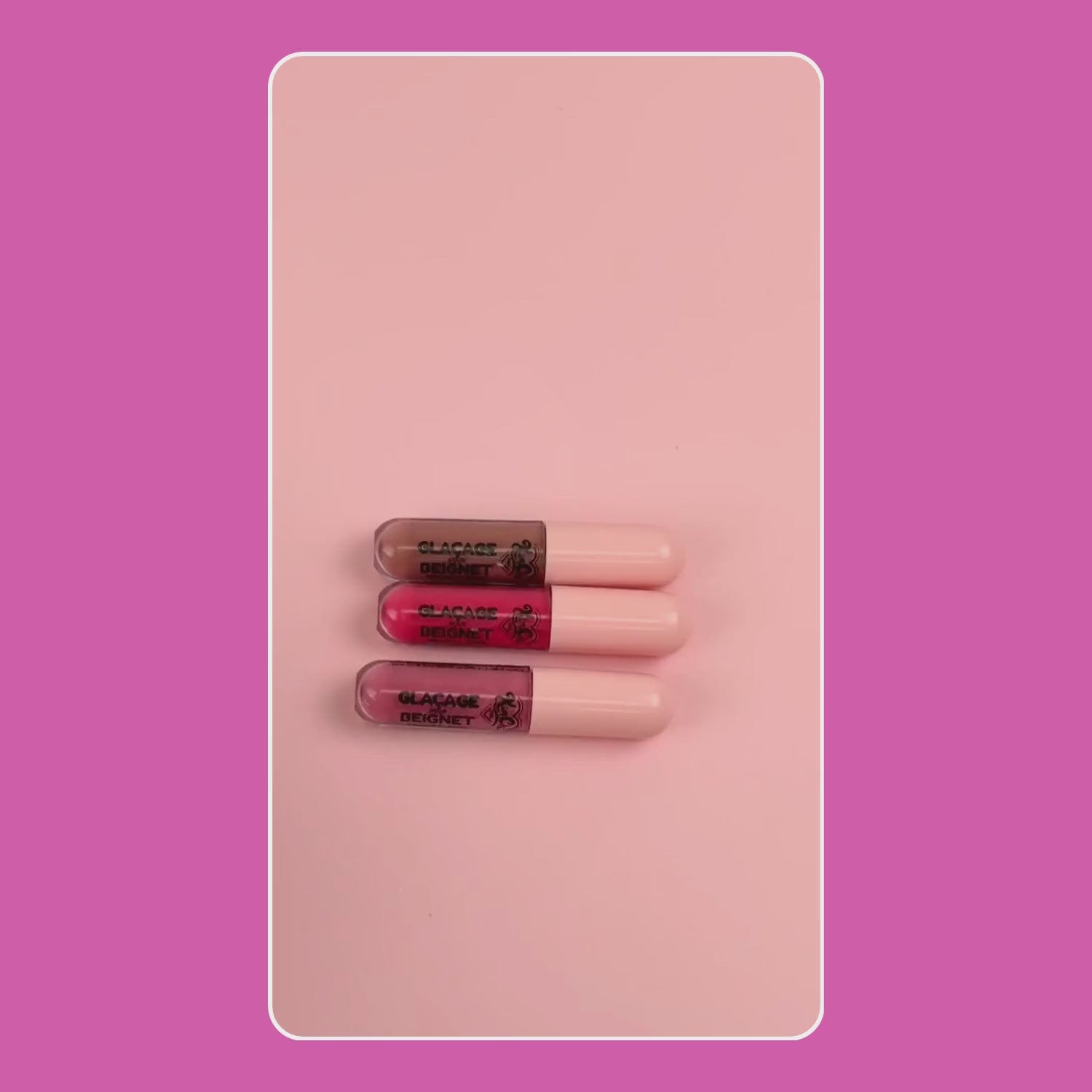 Set of three lip glosses in pink, red, and nude shades, featuring a glossy finish and sleek packaging.