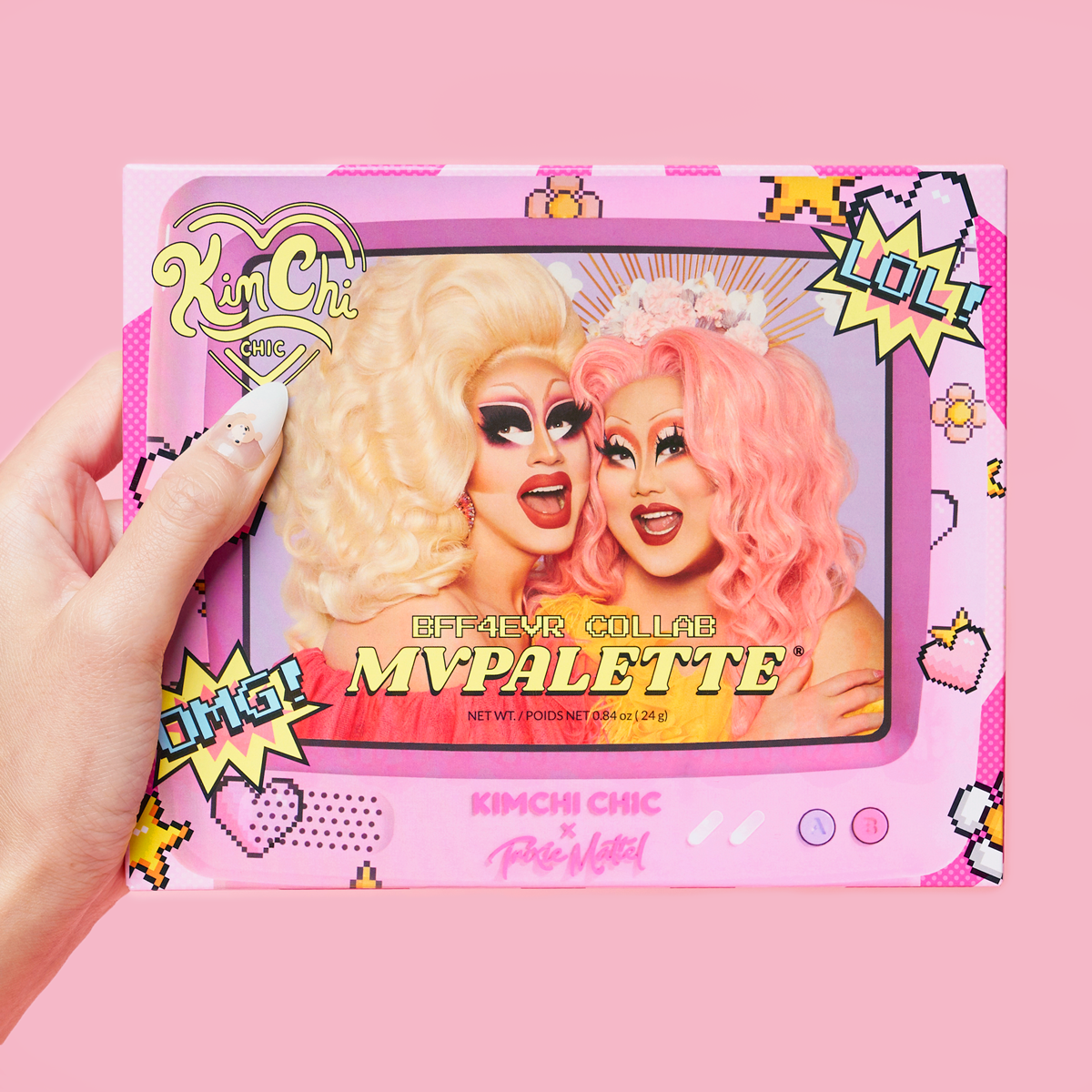 Colorful makeup palette packaging with cartoon-style graphics and two drag performers smiling.