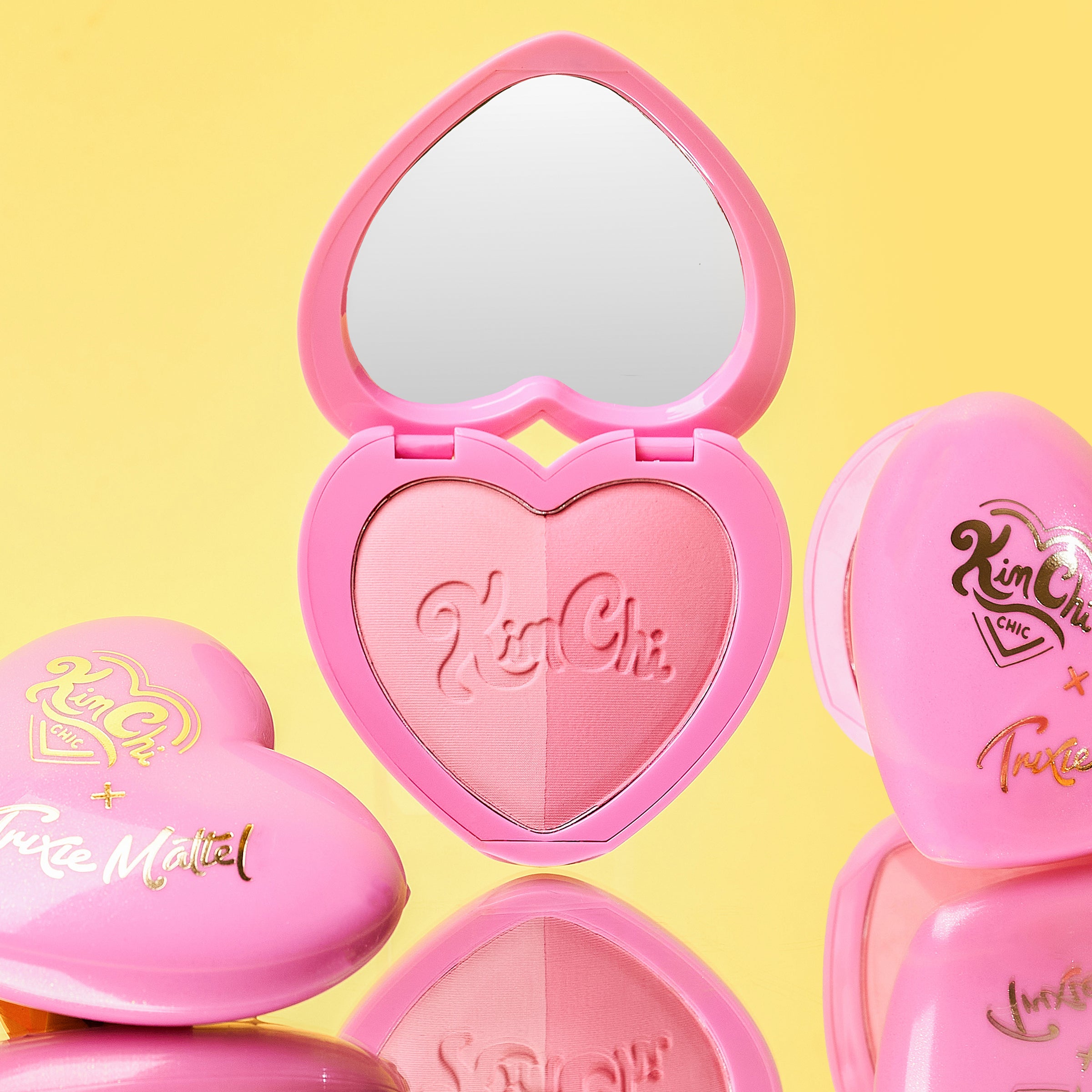 Heart-shaped pink makeup palette with mirror and Kim Chi logo