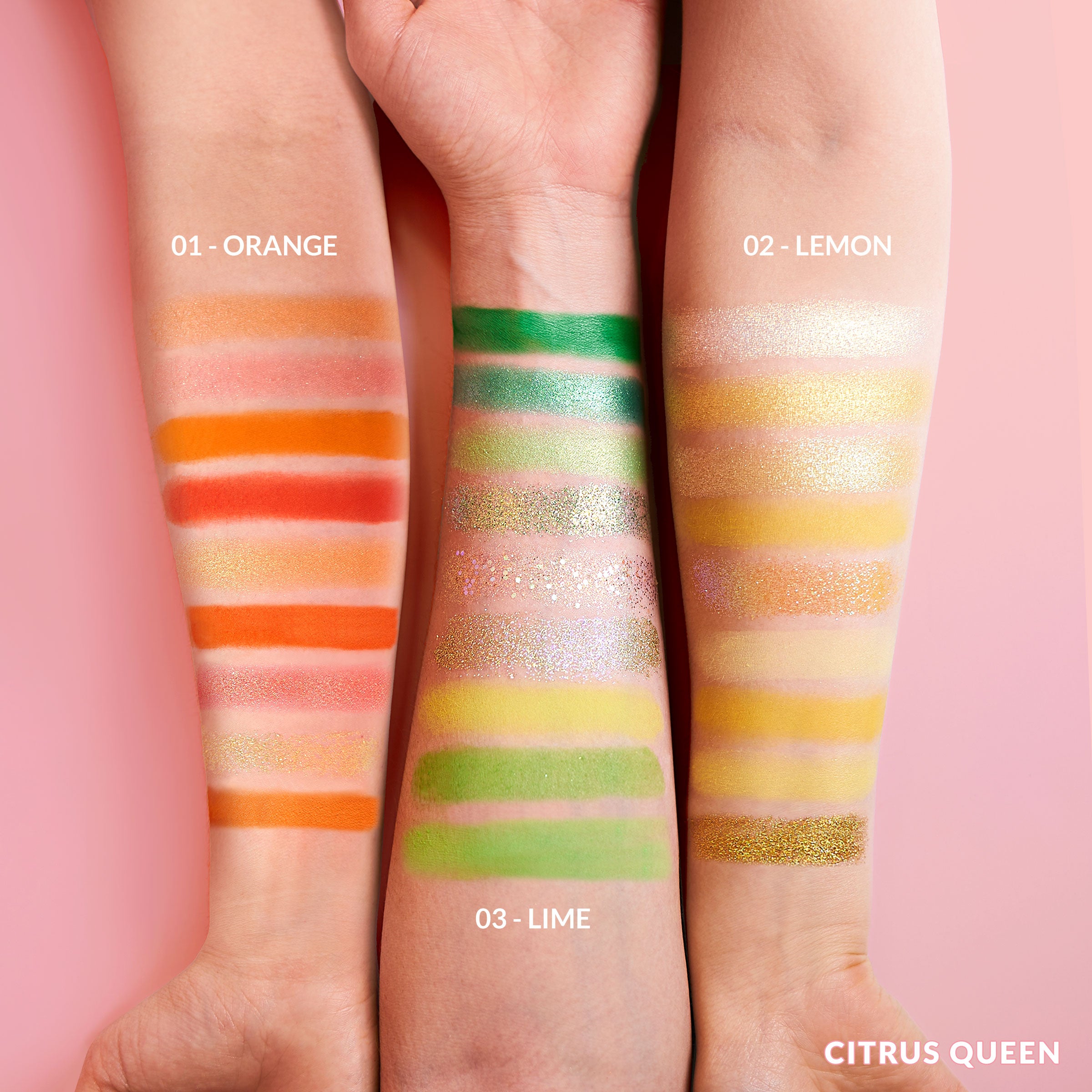 Arms displaying swatches of colorful eyeshadows labeled Orange, Lemon, and Lime on a pink background.