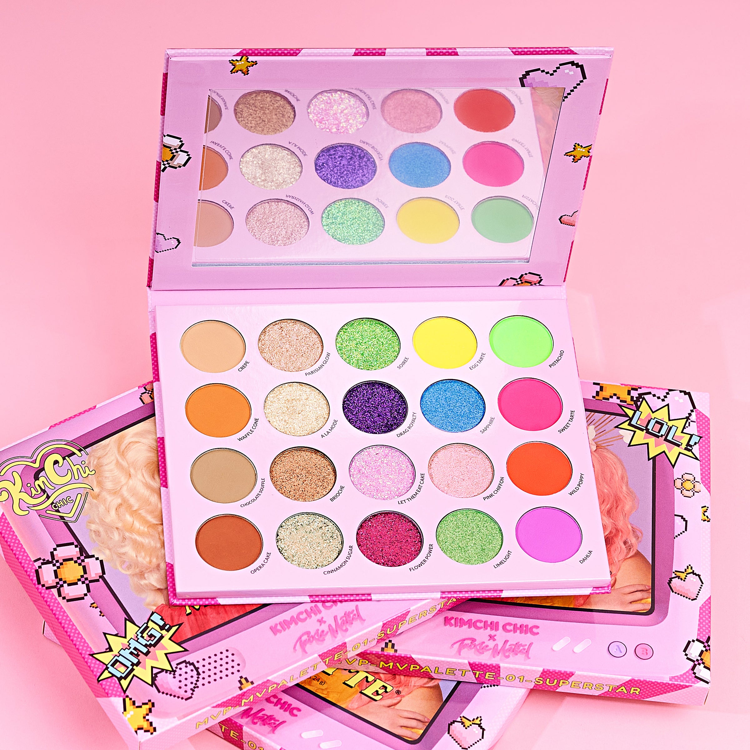 Colorful makeup palette with various shades in a pink-themed packaging.