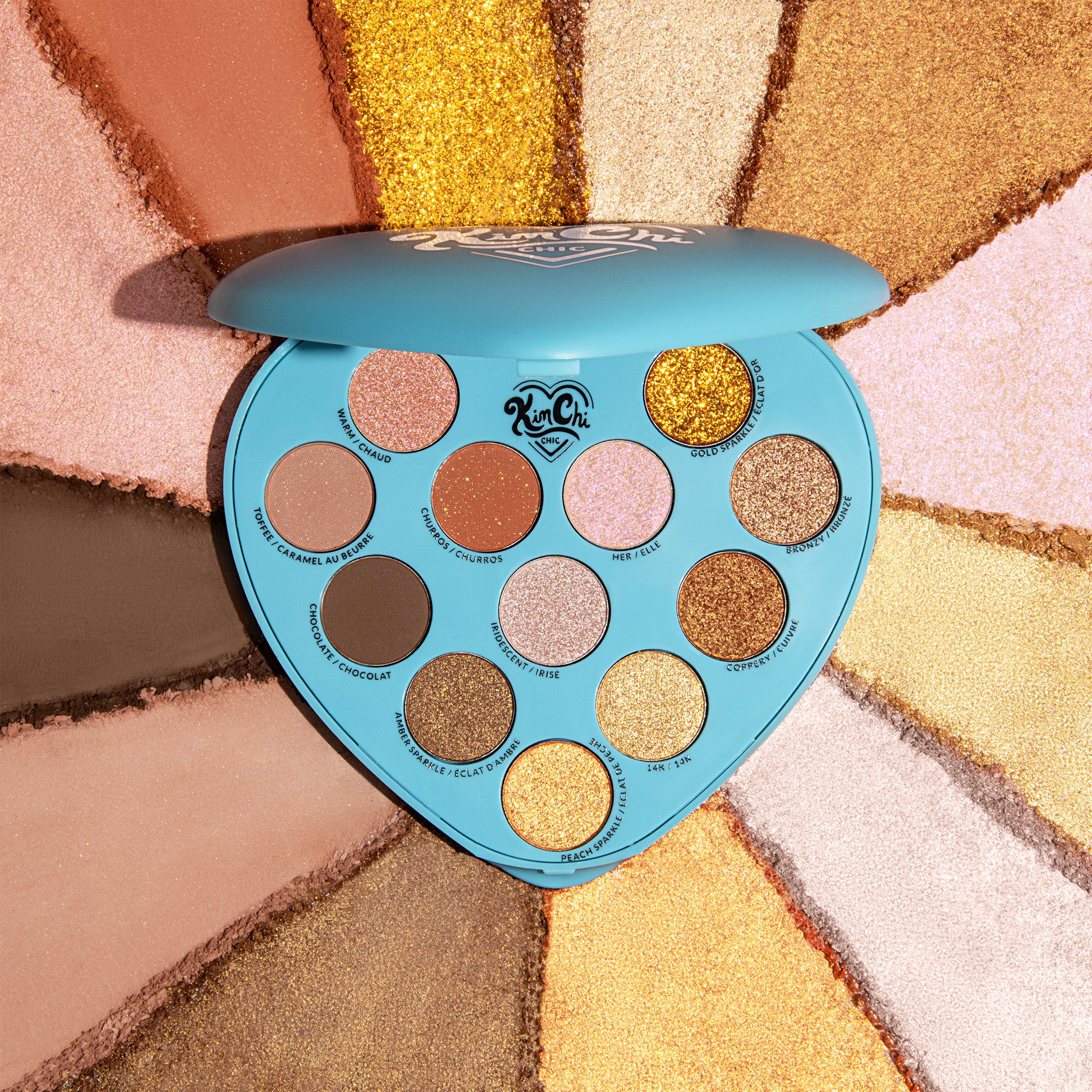 Heart-shaped eyeshadow palette with various shades of brown, gold, and pink.