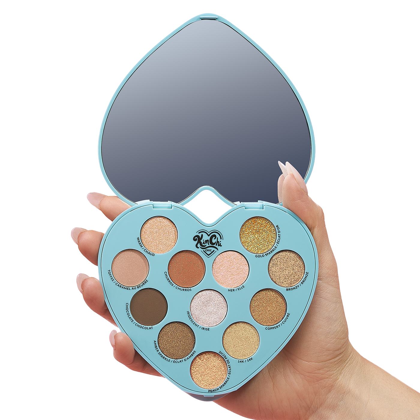 Hand holding a heart-shaped makeup palette with mirror and 12 eyeshadow colors.