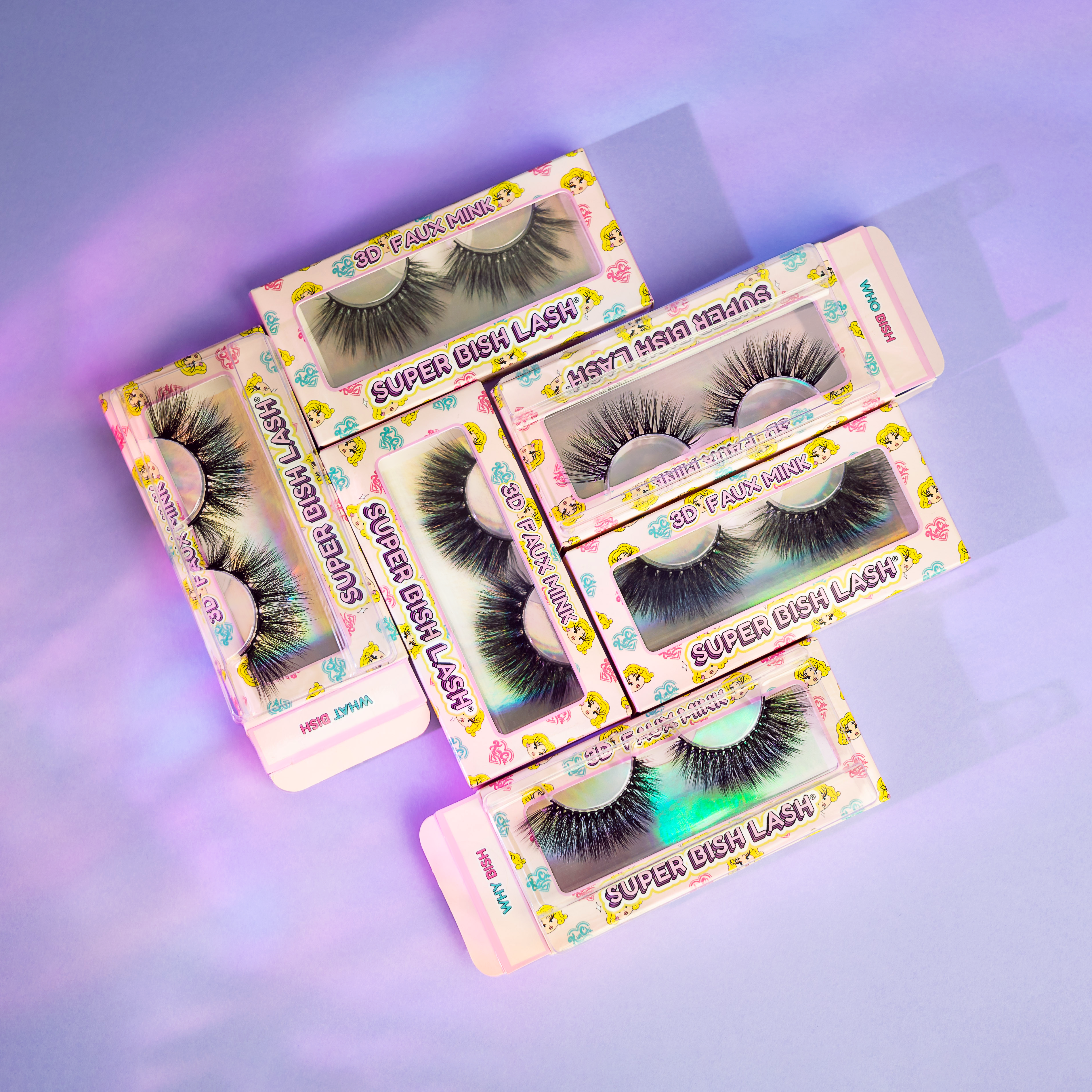 Colorful packaging of false eyelashes on a purple background