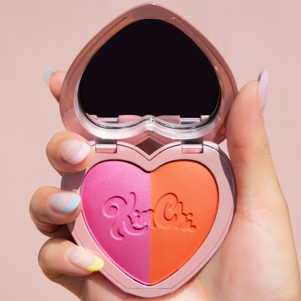 grouped KimChi-Chic-Beauty-Thailor-Collection-Blush-Duo-02-Mercedes heart compact in hand